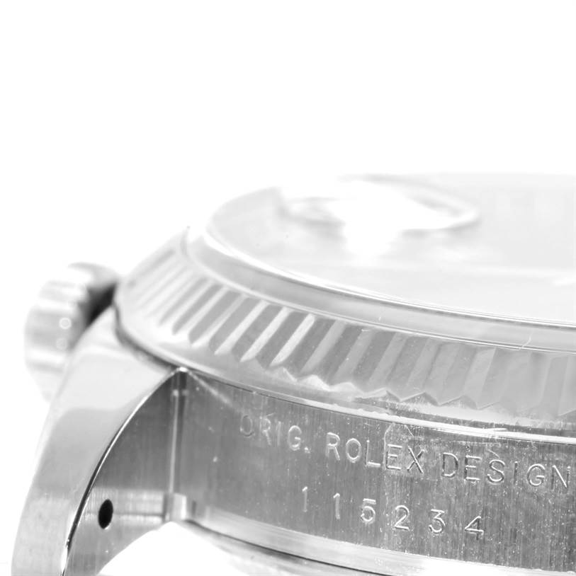 This image shows a close-up side view of the bezel, crown, and case of a Rolex Datejust 115234 Men
s Stainless Steel Black Dial 115234 Men
s Stainless Steel Black Dial model watch.