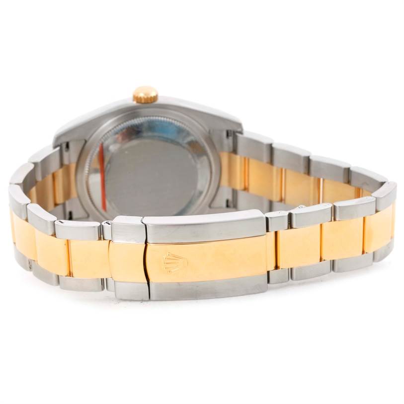 This image shows the back view of a Rolex Datejust 116203 Men
s Stainless Steel Champagne Dial 116203 Men
s Stainless Steel Champagne Dial watch, focusing on its gold and silver bracelet and clasp.