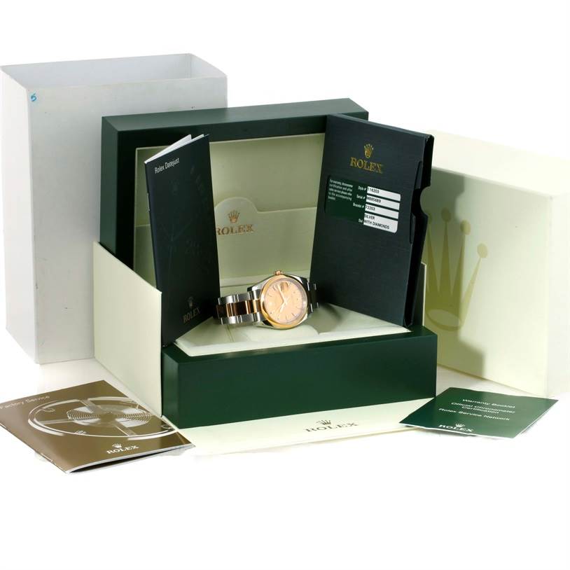 This image shows the Rolex Datejust 116203 Men
s Stainless Steel Champagne Dial 116203 Men
s Stainless Steel Champagne Dial watch from a front angle, including its box, warranty card, manuals, and outer packaging.