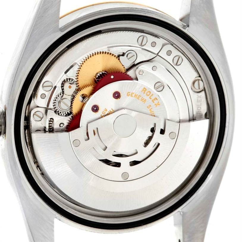 This image shows the internal movement and mechanism of a Rolex Datejust 116203 Men
s Stainless Steel Champagne Dial 116203 Men
s Stainless Steel Champagne Dial watch from a rear angle with the back case removed.