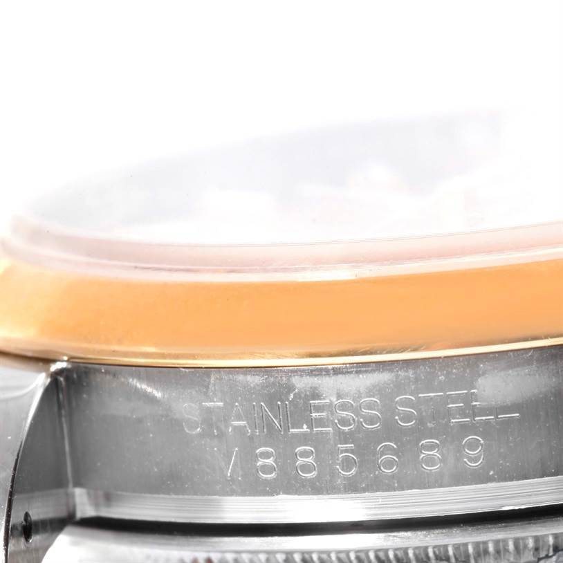 The image shows a close-up of the side of the Rolex Datejust 116203 Men
s Stainless Steel Champagne Dial 116203 Men
s Stainless Steel Champagne Dial watch, highlighting the inscription "STAINLESS STEEL / 885689."
