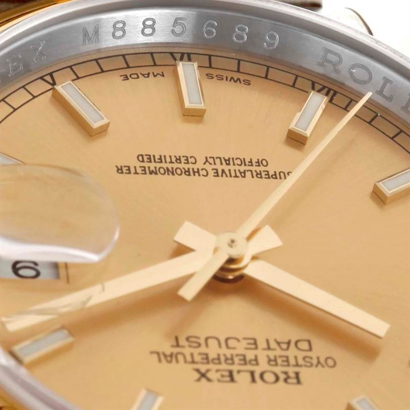 This close-up image shows the dial, hands, and part of the outer bezel of a Rolex Datejust 116203 Men
s Stainless Steel Champagne Dial 116203 Men
s Stainless Steel Champagne Dial watch.