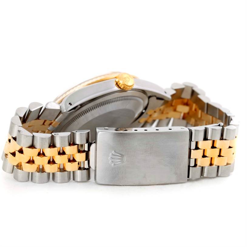 The image shows the clasp, bracelet, and side of the case with the crown of the Rolex Datejust 16233 Men's Steel and Gold (two tone) Champagne Dial 16233 Men's Steel and Gold (two tone) Champagne Dial watch from a side angle.