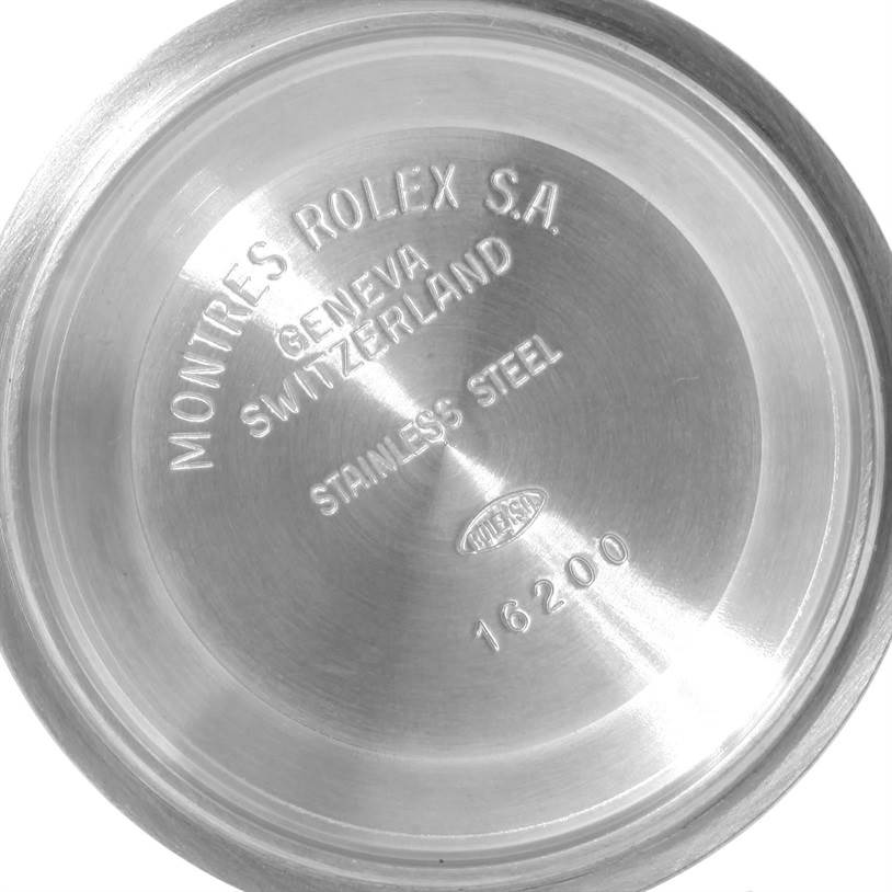 This image shows the stainless steel case back of a Rolex Datejust 16233 Men's Steel and Gold (two tone) Champagne Dial 16233 Men's Steel and Gold (two tone) Champagne Dial model with engraved details.