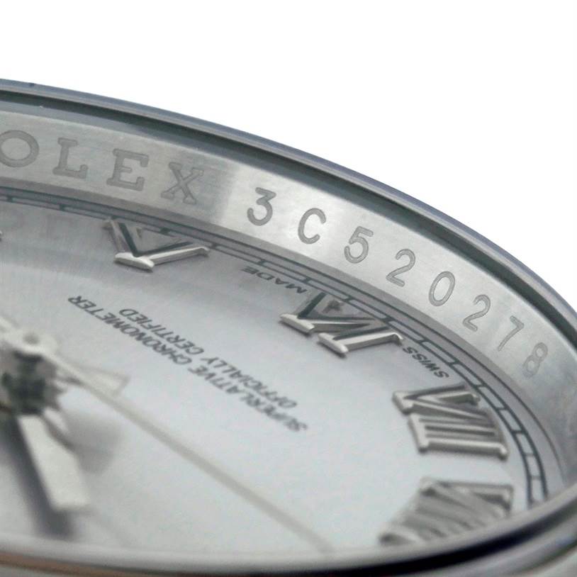 The image shows a close-up angle of the dial and inner rim of a Rolex Datejust 116200 Men
s Stainless Steel Grey Dial 116200 Men
s Stainless Steel Grey Dial watch, displaying the serial number.