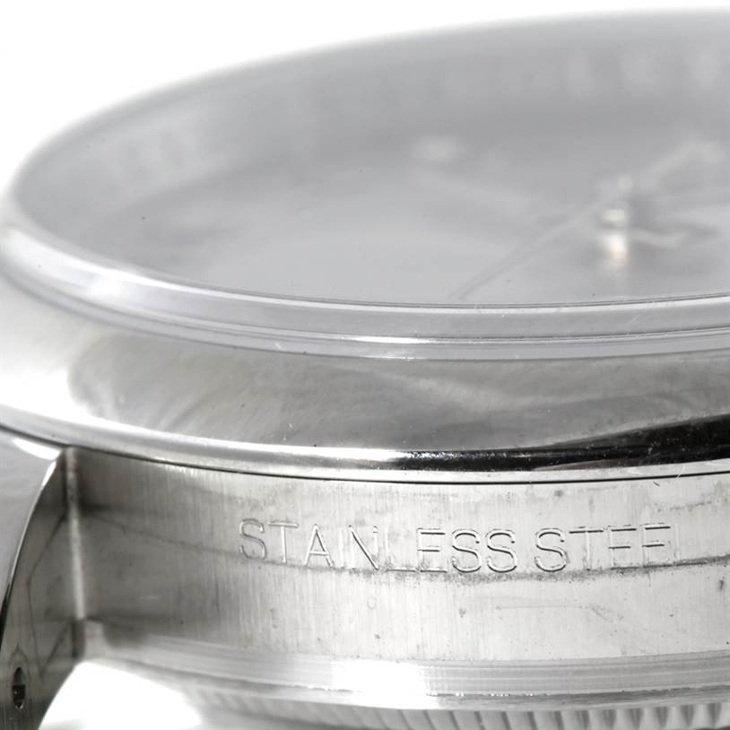 The image shows a close-up side view of the stainless steel case of a Rolex Datejust 116200 Men
s Stainless Steel Grey Dial 116200 Men
s Stainless Steel Grey Dial watch.