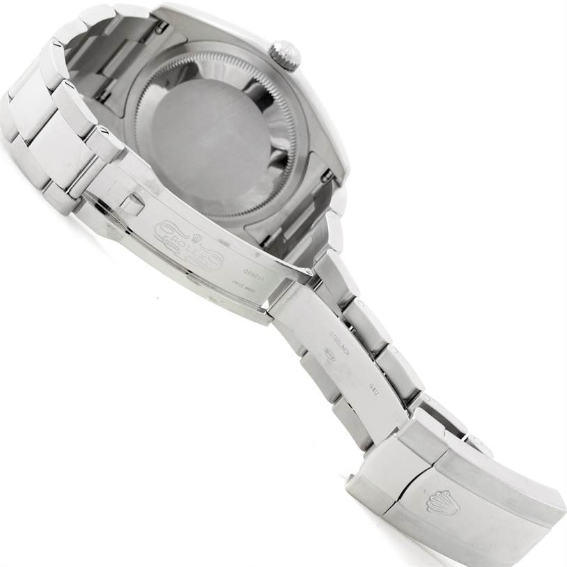 The image shows the back case and bracelet of the Rolex Datejust 116200 Men
s Stainless Steel Grey Dial 116200 Men
s Stainless Steel Grey Dial watch, including the clasp with the Rolex logo.