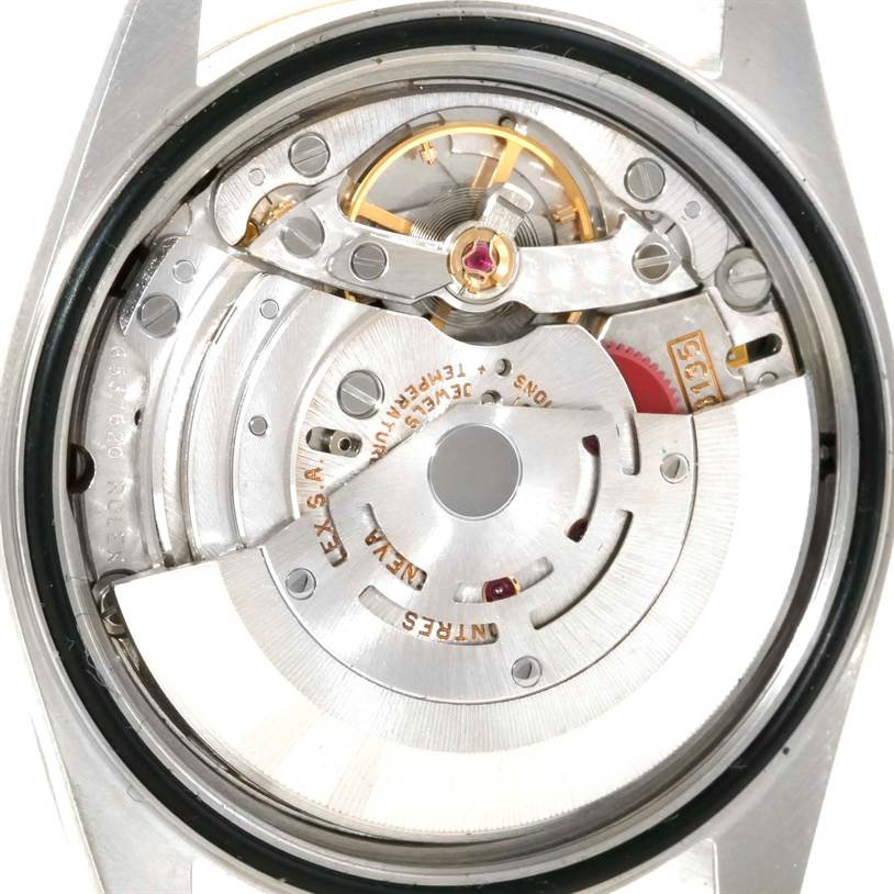 The image shows a close-up view of the internal mechanism of a Rolex Datejust 16233 Men's Steel and Gold (two tone) Champagne Dial 16233 Men's Steel and Gold (two tone) Champagne Dial watch.
