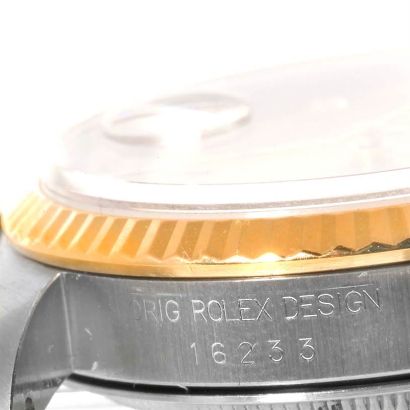 The image shows a close-up side view of the bezel and casing of the Rolex Datejust 16233 Men's Steel and Gold (two tone) Champagne Dial 16233 Men's Steel and Gold (two tone) Champagne Dial, highlighting the model number 16233.