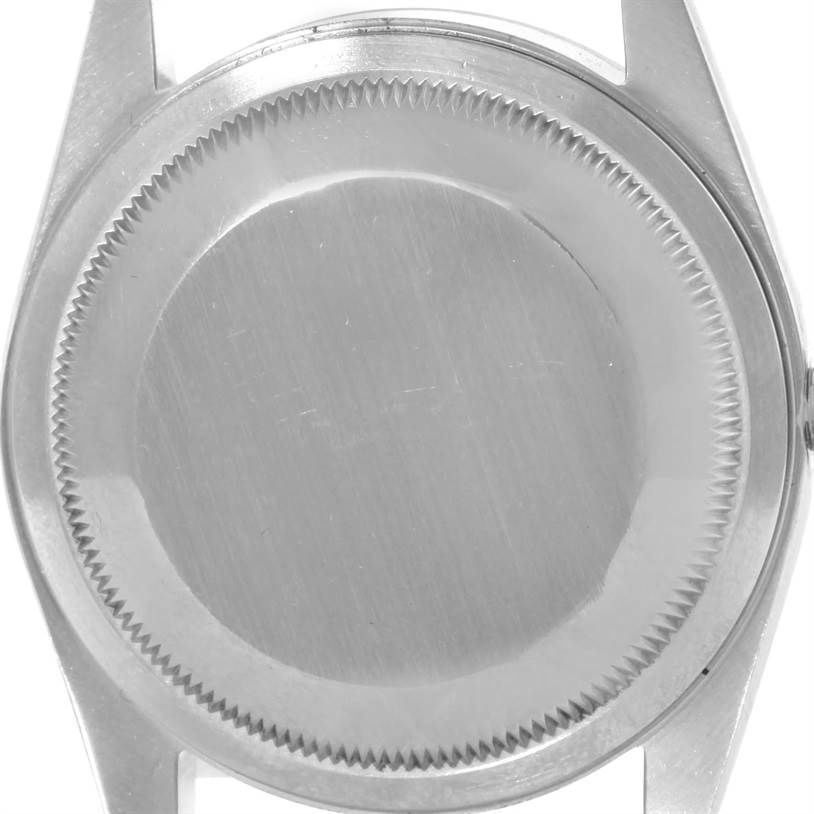 This image shows the case back of a Rolex Datejust 16233 Men's Steel and Gold (two tone) Champagne Dial 16233 Men's Steel and Gold (two tone) Champagne Dial watch from a direct top-down angle.