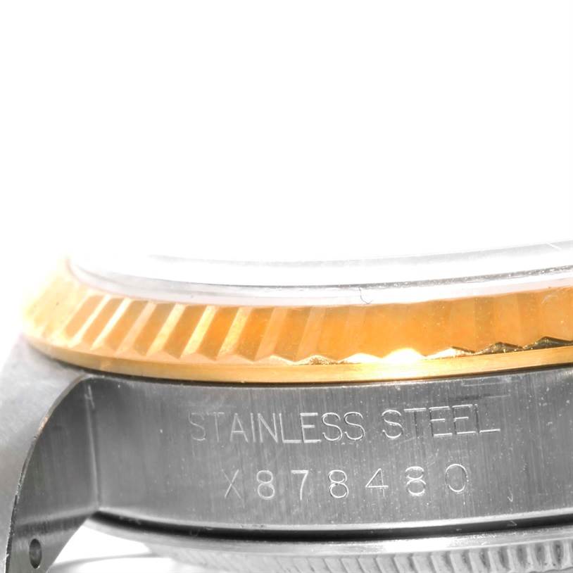 The image shows a close-up angle of the side of a Rolex Datejust 16233 Men's Steel and Gold (two tone) Champagne Dial 16233 Men's Steel and Gold (two tone) Champagne Dial watch, highlighting the stainless steel case and part of the bezel.
