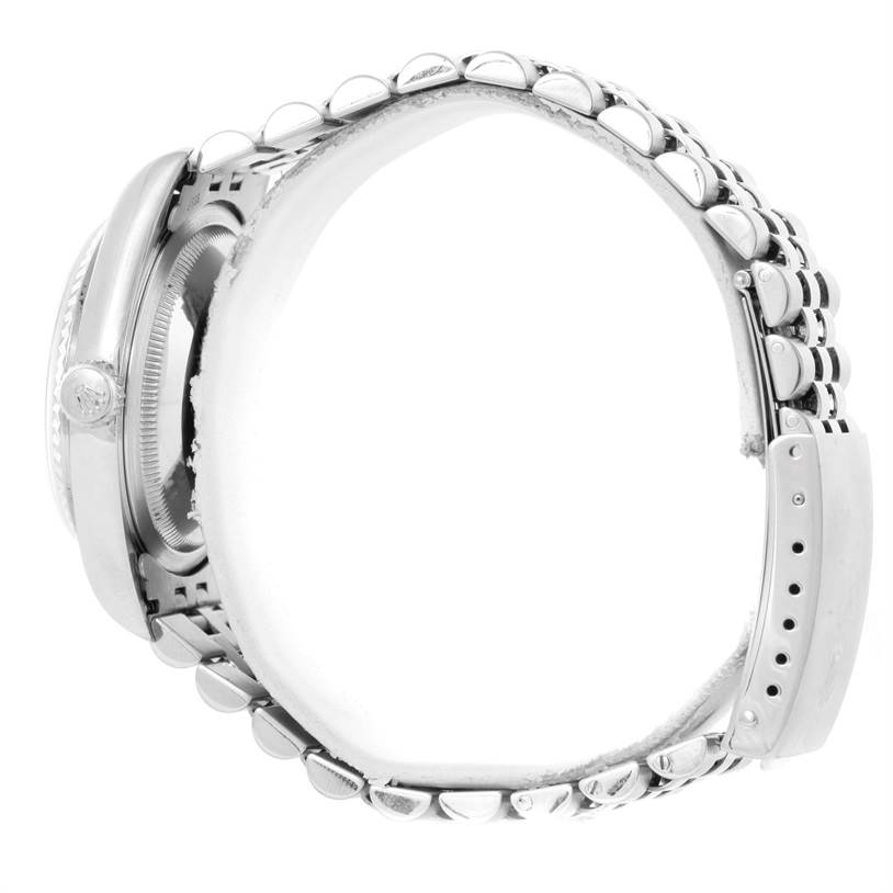 This side view of the Rolex Datejust 16234 Men's Stainless Steel Silver Dial 16234 Men's Stainless Steel Silver Dial watch highlights its crown, bezel, and linked bracelet.