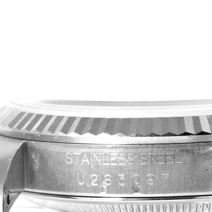 This close-up image shows the side view of the bezel and case with engravings of the Rolex Datejust 16234 Men's Stainless Steel Silver Dial 16234 Men's Stainless Steel Silver Dial model.