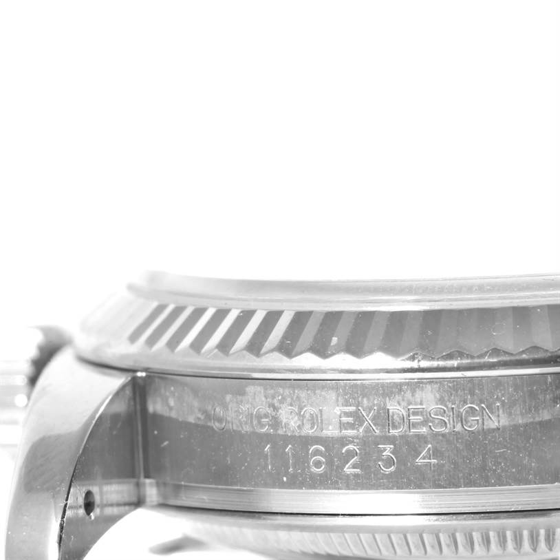 This image shows a close-up side view of the Rolex Datejust 116234 Men's Stainless Steel Silver Dial 116234 Men's Stainless Steel Silver Dial watch, displaying the fluted bezel and model number.