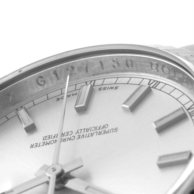 The image shows a close-up angle of the dial and part of the rehaut with the serial number and "ROLEX" engraving on a Rolex Datejust 116234 Men's Stainless Steel Silver Dial 116234 Men's Stainless Steel Silver Dial.