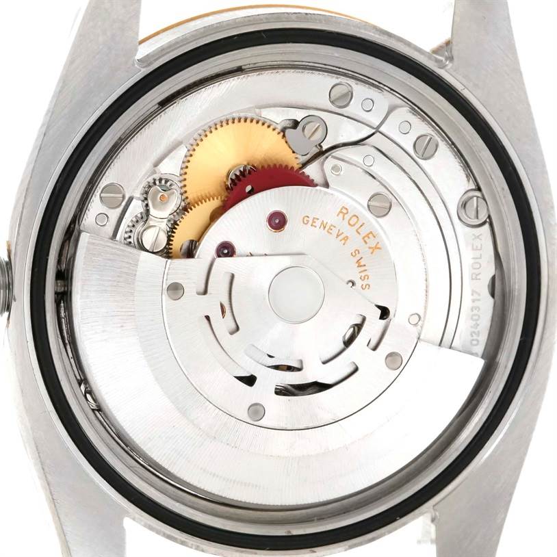 The image shows the internal mechanism and movement of a Rolex Datejust 116233 Men's Stainless Steel Blue Dial 116233 Men's Stainless Steel Blue Dial watch from the back view.