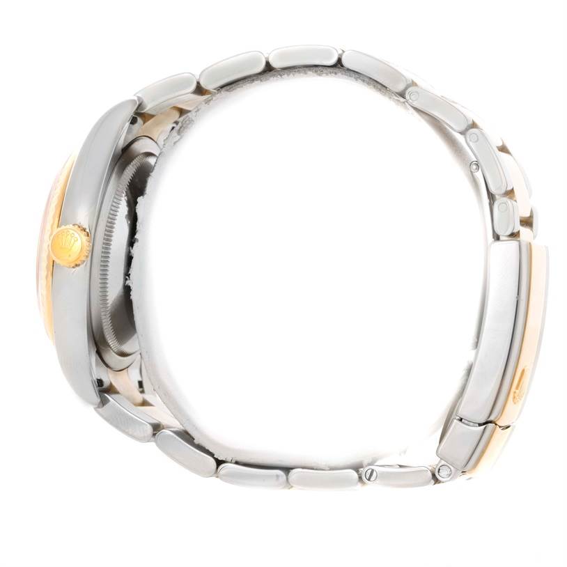 The image shows a side view of a Rolex Datejust 116233 Men's Stainless Steel Blue Dial 116233 Men's Stainless Steel Blue Dial watch, highlighting the crown, case, and metal bracelet.