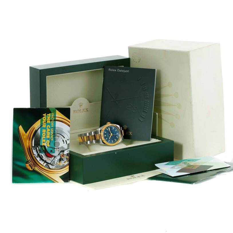 The image shows a Rolex Datejust 116233 Men's Stainless Steel Blue Dial 116233 Men's Stainless Steel Blue Dial watch at an oblique angle with its presentation box, booklets, and warranty card.