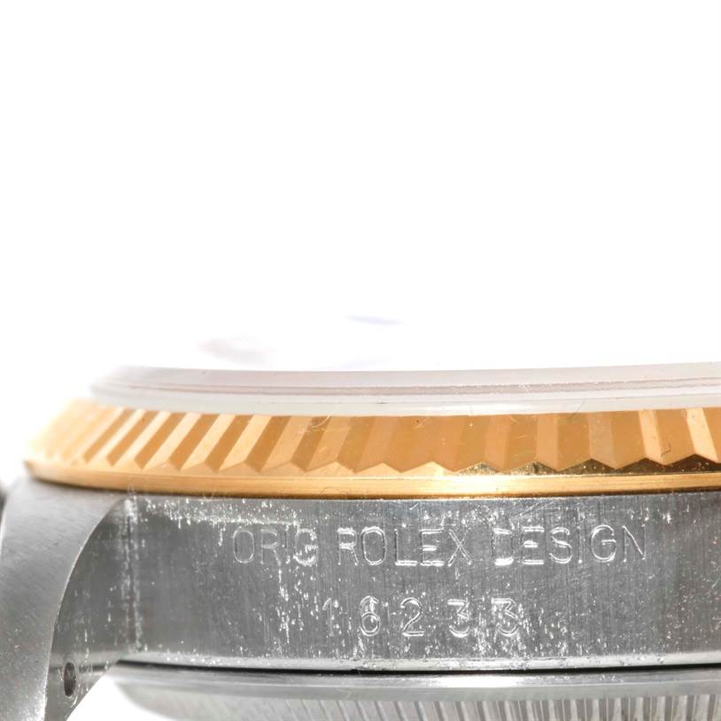 The image shows a close-up side view of the bezel and casing of a Rolex Datejust 16233 Men's Steel and Gold (two tone) Champagne Dial 16233 Men's Steel and Gold (two tone) Champagne Dial model wristwatch.
