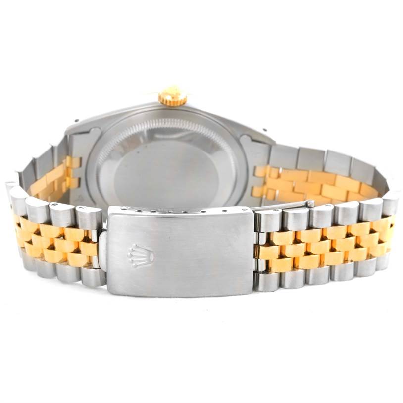 The image shows the back view of a Rolex Datejust 16233 Men's Steel and Gold (two tone) Champagne Dial 16233 Men's Steel and Gold (two tone) Champagne Dial watch, highlighting the case back and two-tone bracelet with the clasp.