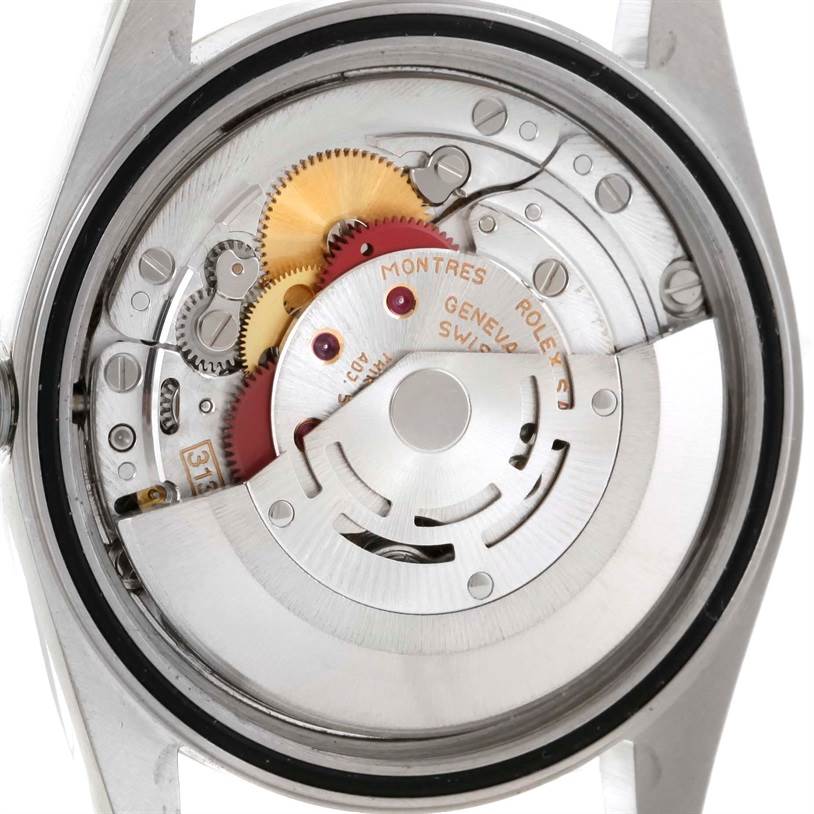 This is a close-up view of the movement mechanism inside a Rolex Datejust 16233 Men
s Steel and Gold (two tone) White Dial 16233 Men
s Steel and Gold (two tone) White Dial watch.