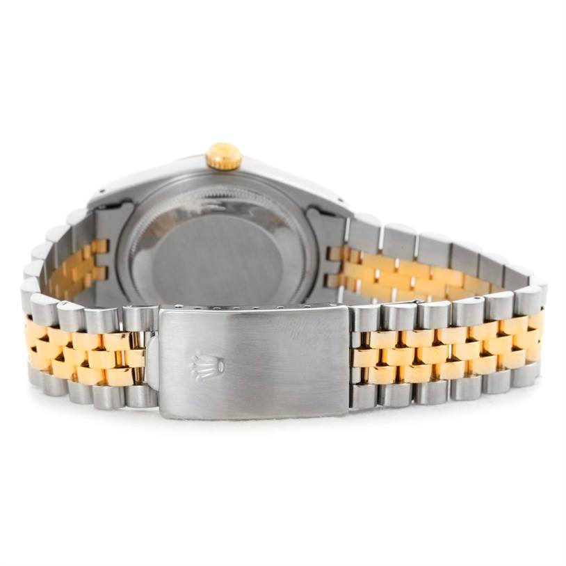 This image shows the back of the Rolex Datejust 16233 Men
s Steel and Gold (two tone) Silver Dial 16233 Men
s Steel and Gold (two tone) Silver Dial watch, highlighting its two-tone Jubilee bracelet and clasp.