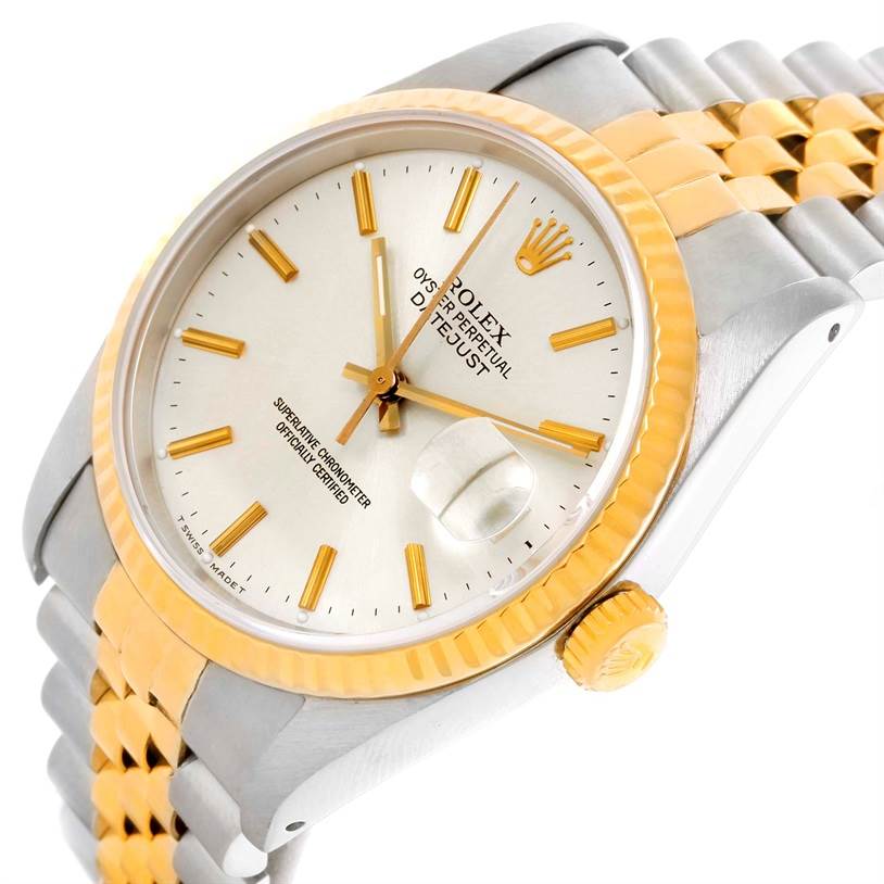 This is an angled view of a Rolex Datejust 16233 Men
s Steel and Gold (two tone) Silver Dial 16233 Men
s Steel and Gold (two tone) Silver Dial watch, displaying the face, bezel, crown, and bracelet.
