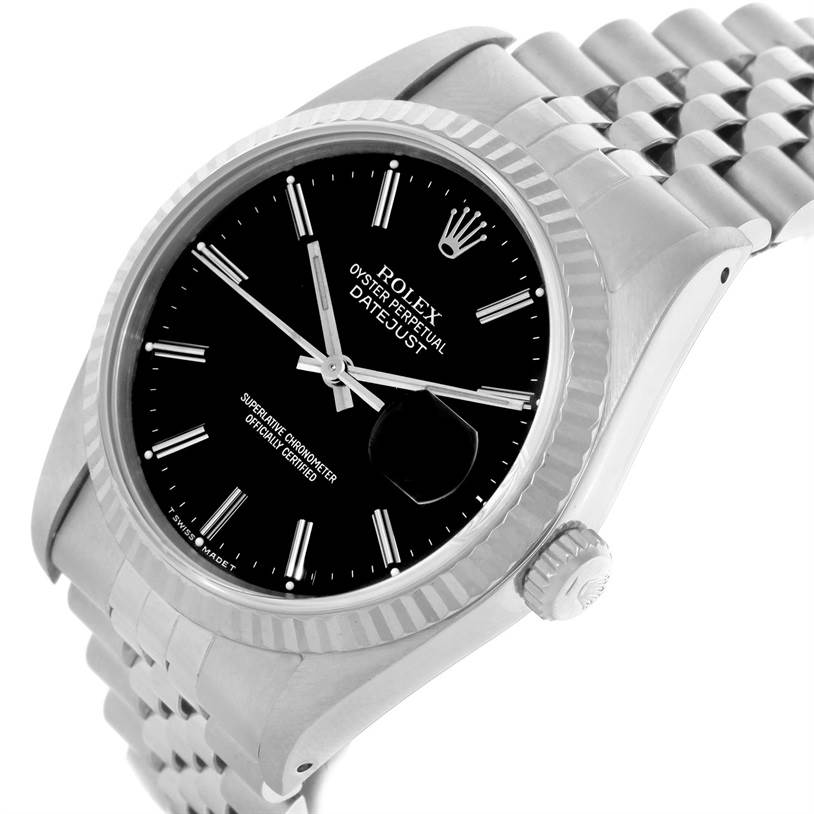 The image shows a Rolex Datejust 16234 Men's Stainless Steel Silver Dial 16234 Men's Stainless Steel Silver Dial watch from an angled side view featuring its case, crown, bezel, black dial, and bracelet.