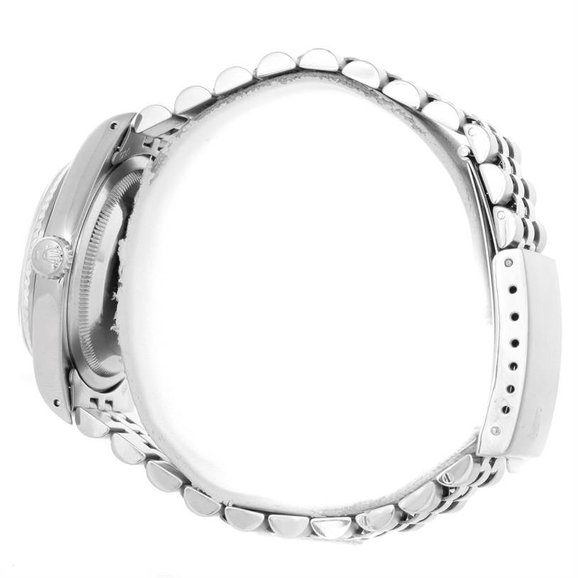 Side view of the Rolex Datejust 16234 Men's Stainless Steel Silver Dial 16234 Men's Stainless Steel Silver Dial watch showcasing the crown, bezel, and bracelet.