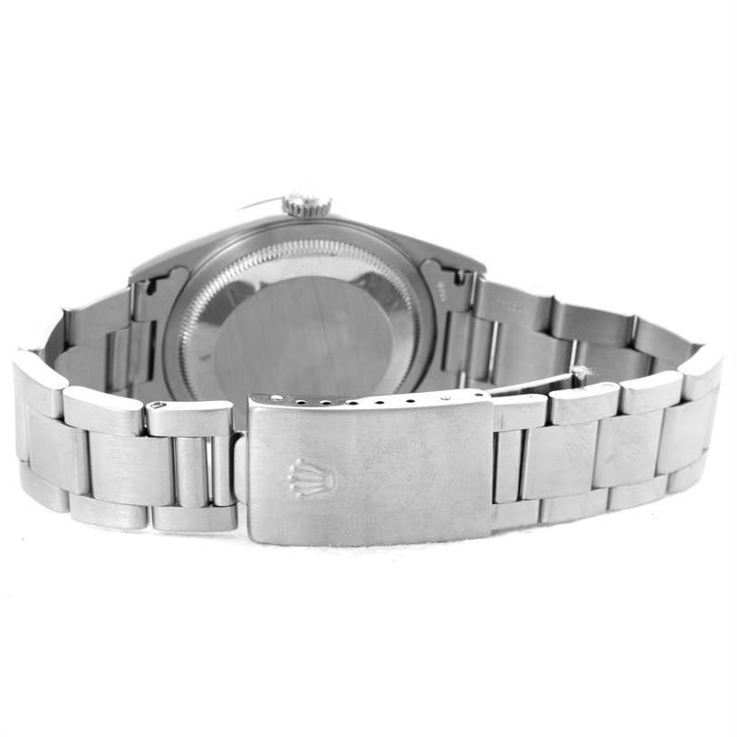 The image shows the back view of a Rolex Datejust 16234 Men
s Stainless Steel Pink Dial 16234 Men
s Stainless Steel Pink Dial watch, highlighting its clasp and bracelet.