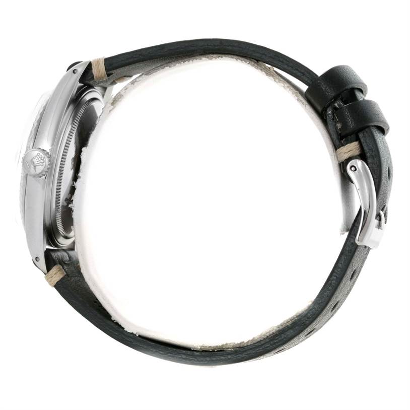 The image shows a side view of the Rolex Datejust 1603 Men's Stainless Steel Silver Dial 1603 Men's Stainless Steel Silver Dial watch, focusing on the crown and a portion of the strap and buckle.