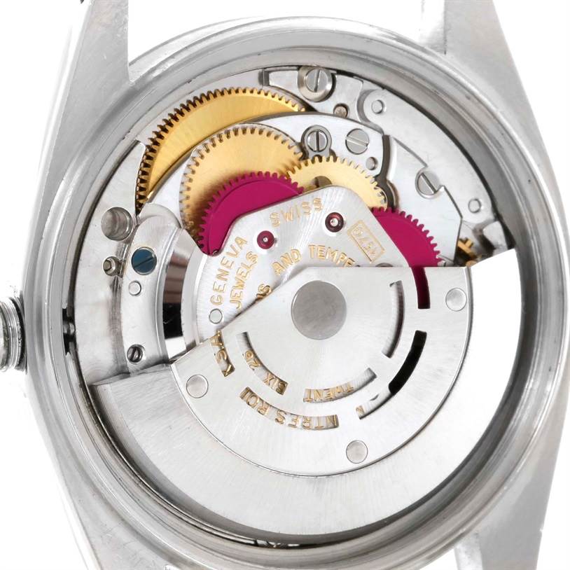 This image shows the internal mechanical movement of a Rolex Datejust 1603 Men's Stainless Steel Silver Dial 1603 Men's Stainless Steel Silver Dial watch with visible gears and components.