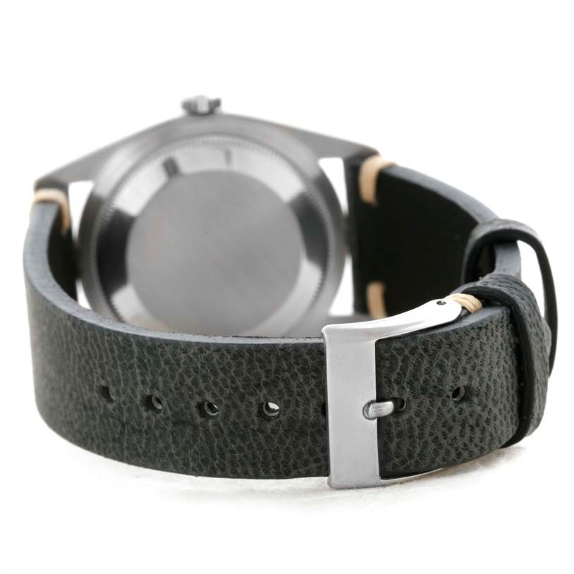 The image shows the back view of a Rolex Datejust 16234 Men's Stainless Steel Silver Dial 16234 Men's Stainless Steel Silver Dial watch, highlighting the case back and leather strap with buckle.