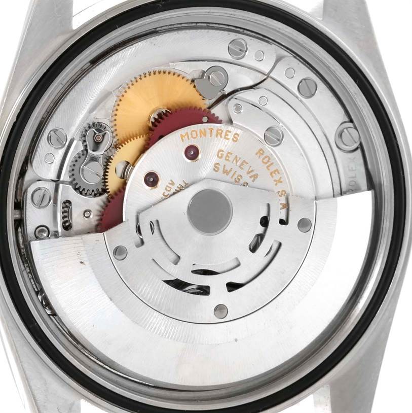 The image shows the internal mechanism of a Rolex Datejust 16234 Men's Stainless Steel Silver Dial 16234 Men's Stainless Steel Silver Dial watch at close-up, highlighting gears and components.