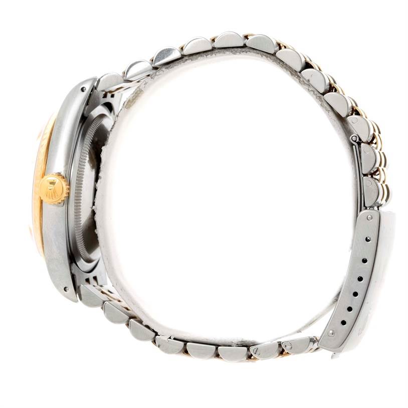 This image shows the side profile of a Rolex Datejust 16233 Men's Steel and Gold (two tone) Champagne Dial 16233 Men's Steel and Gold (two tone) Champagne Dial watch, highlighting the case, crown, and bracelet with clasp.