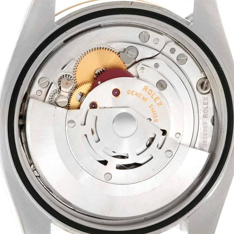 This is a close-up view of the mechanical movement inside the Rolex Datejust 116233 Men
s Stainless Steel Champagne Dial 116233 Men
s Stainless Steel Champagne Dial watch, showing the gears and inner workings.