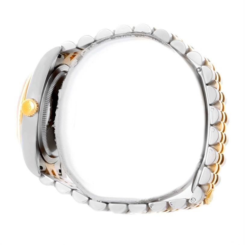 This image shows a side view of the Rolex Datejust 116233 Men
s Stainless Steel Champagne Dial 116233 Men
s Stainless Steel Champagne Dial watch, highlighting the crown and bracelet.