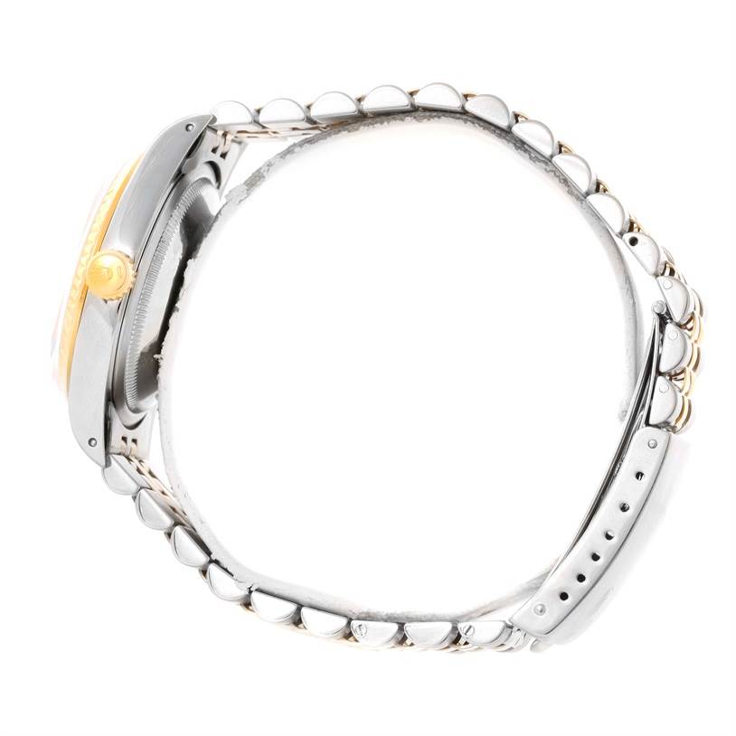 This image shows a side view of the Rolex Datejust 16233 Men's Steel and Gold (two tone) Silver Dial 16233 Men's Steel and Gold (two tone) Silver Dial watch, highlighting its crown, bezel, and bracelet.