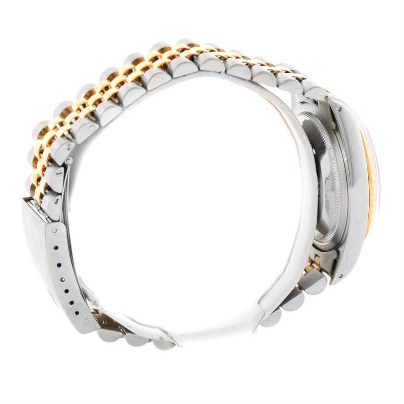 The image shows the side view of a Rolex Datejust 16233 Men's Steel and Gold (two tone) Silver Dial 16233 Men's Steel and Gold (two tone) Silver Dial watch, focusing on the bracelet and parts of the case.