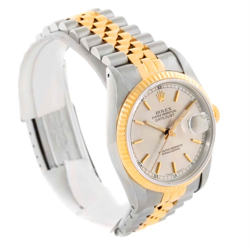 The image shows a side angle of a Rolex Datejust 16233 Men's Steel and Gold (two tone) Silver Dial 16233 Men's Steel and Gold (two tone) Silver Dial watch, highlighting the two-tone bracelet and dial with a fluted bezel.