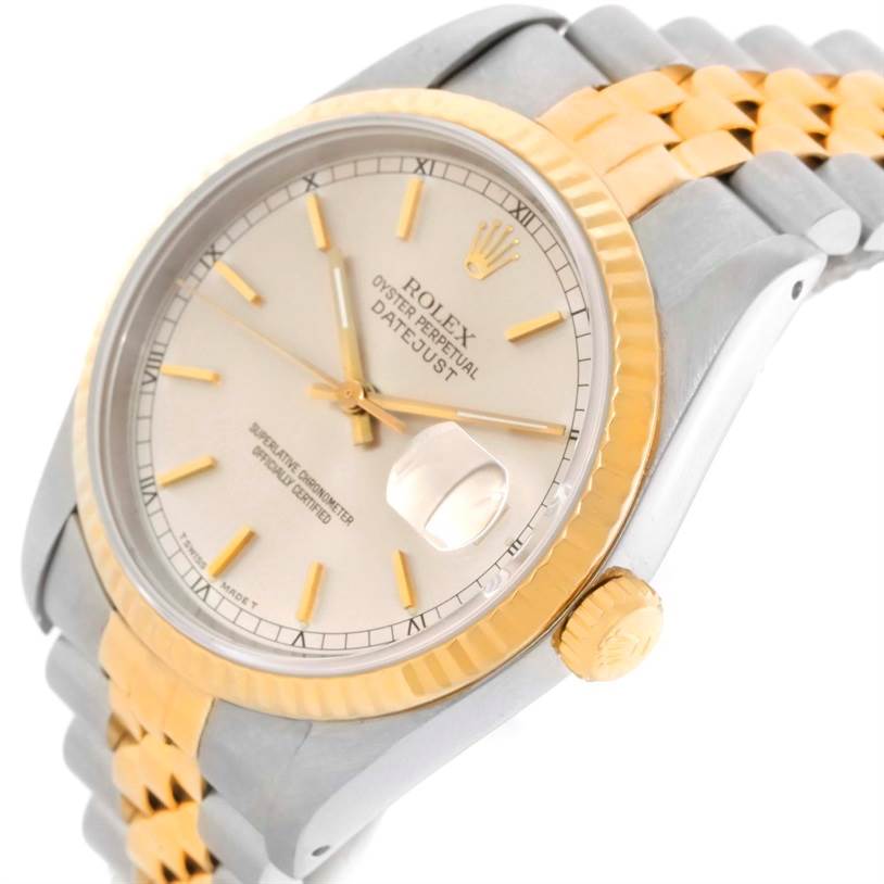 The image shows a close-up, angled view of a Rolex Datejust 16233 Men's Steel and Gold (two tone) Silver Dial 16233 Men's Steel and Gold (two tone) Silver Dial watch, highlighting its face, bezel, crown, and part of the bracelet.