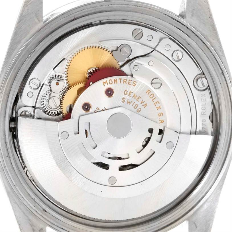 The image shows the intricate internal mechanism of a Rolex Datejust 16220 Men
s Stainless Steel Black Dial 16220 Men
s Stainless Steel Black Dial watch, viewed from the back.