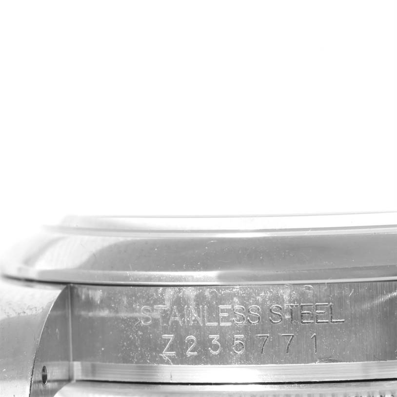 This image shows a close-up of the stainless steel casing and serial number of a Rolex Datejust 116200 Men's Stainless Steel Silver Dial 116200 Men's Stainless Steel Silver Dial watch.