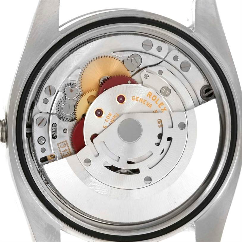This image shows the movement mechanism from the back view of a Rolex Datejust 116200 Men's Stainless Steel Silver Dial 116200 Men's Stainless Steel Silver Dial model watch.