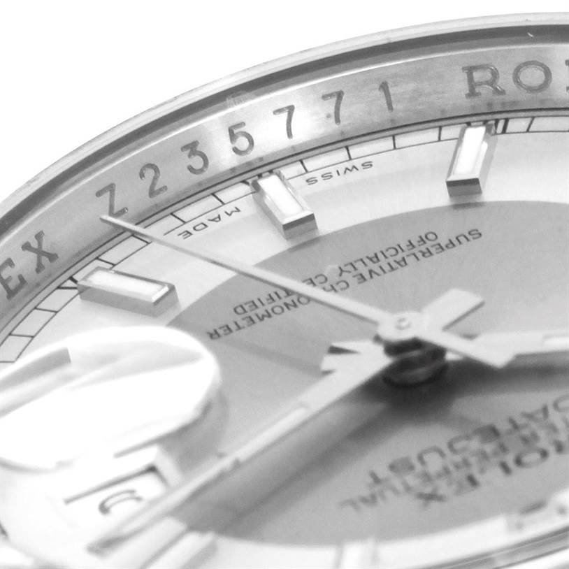 The image shows a close-up side angle of the Rolex Datejust 116200 Men's Stainless Steel Silver Dial 116200 Men's Stainless Steel Silver Dial, focusing on the dial, hands, and serial number.