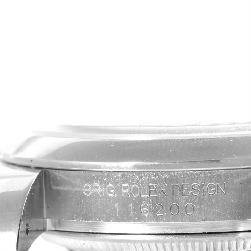 The image shows a close-up side view of the Rolex Datejust 116200 Men's Stainless Steel Silver Dial 116200 Men's Stainless Steel Silver Dial watch case with model number 116200 engraved.