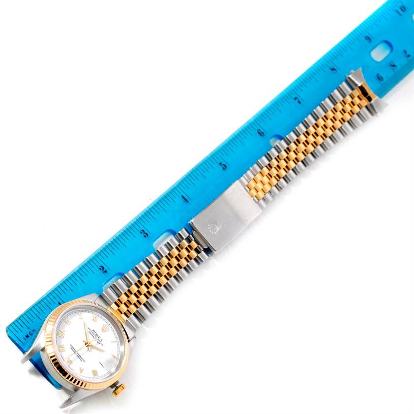 The image shows a flat, top-down view of a Rolex Datejust 16233 Men's Steel and Gold (two tone) White Dial 16233 Men's Steel and Gold (two tone) White Dial watch with a ruler measuring its length and bracelet.