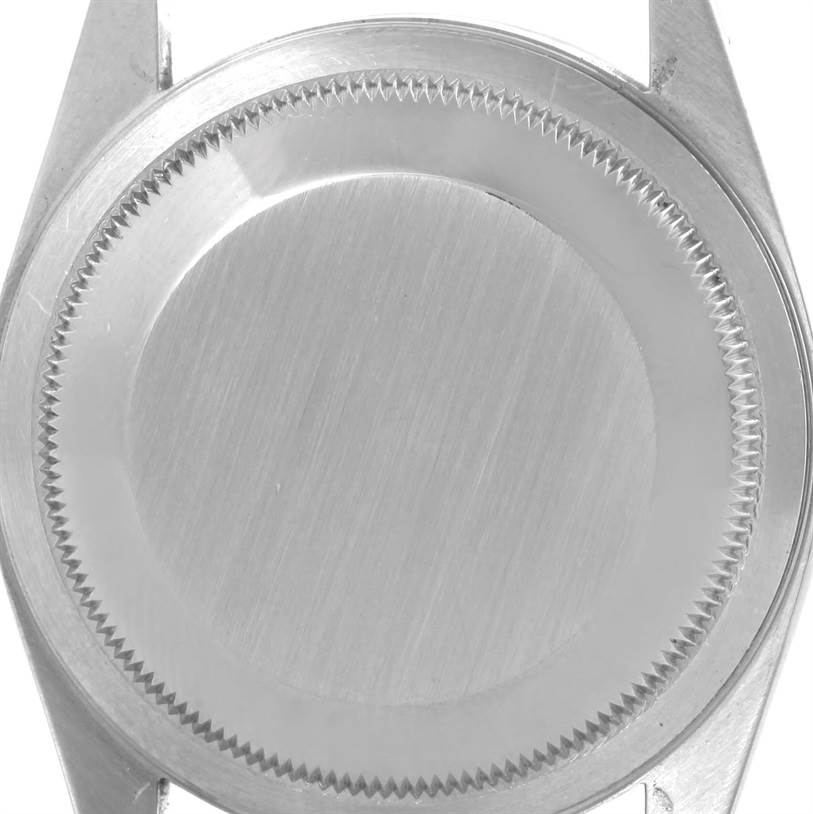 This image shows the case back of a Rolex Datejust 16233 Men's Steel and Gold (two tone) White Dial 16233 Men's Steel and Gold (two tone) White Dial watch, viewed from a top angle.