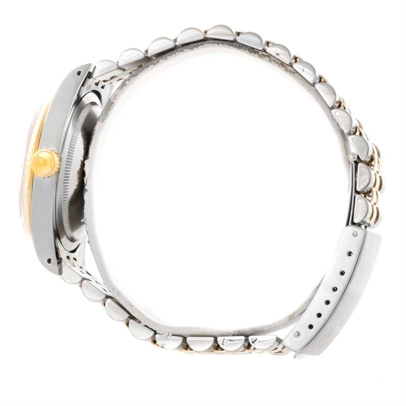 The image shows a side profile view of a Rolex Datejust 16233 Men's Steel and Gold (two tone) White Dial 16233 Men's Steel and Gold (two tone) White Dial watch, highlighting its bracelet and crown.