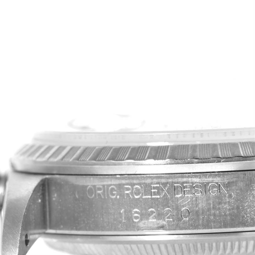 This image shows the side of a Rolex Datejust 16220 Men
s Stainless Steel Blue Dial 16220 Men
s Stainless Steel Blue Dial watch, displaying the model number 16220 and the "Orig Rolex Design" inscription.